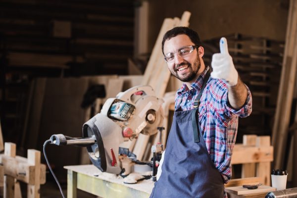 portrait-of-smiling-construction-worker-thumb-up.jpg